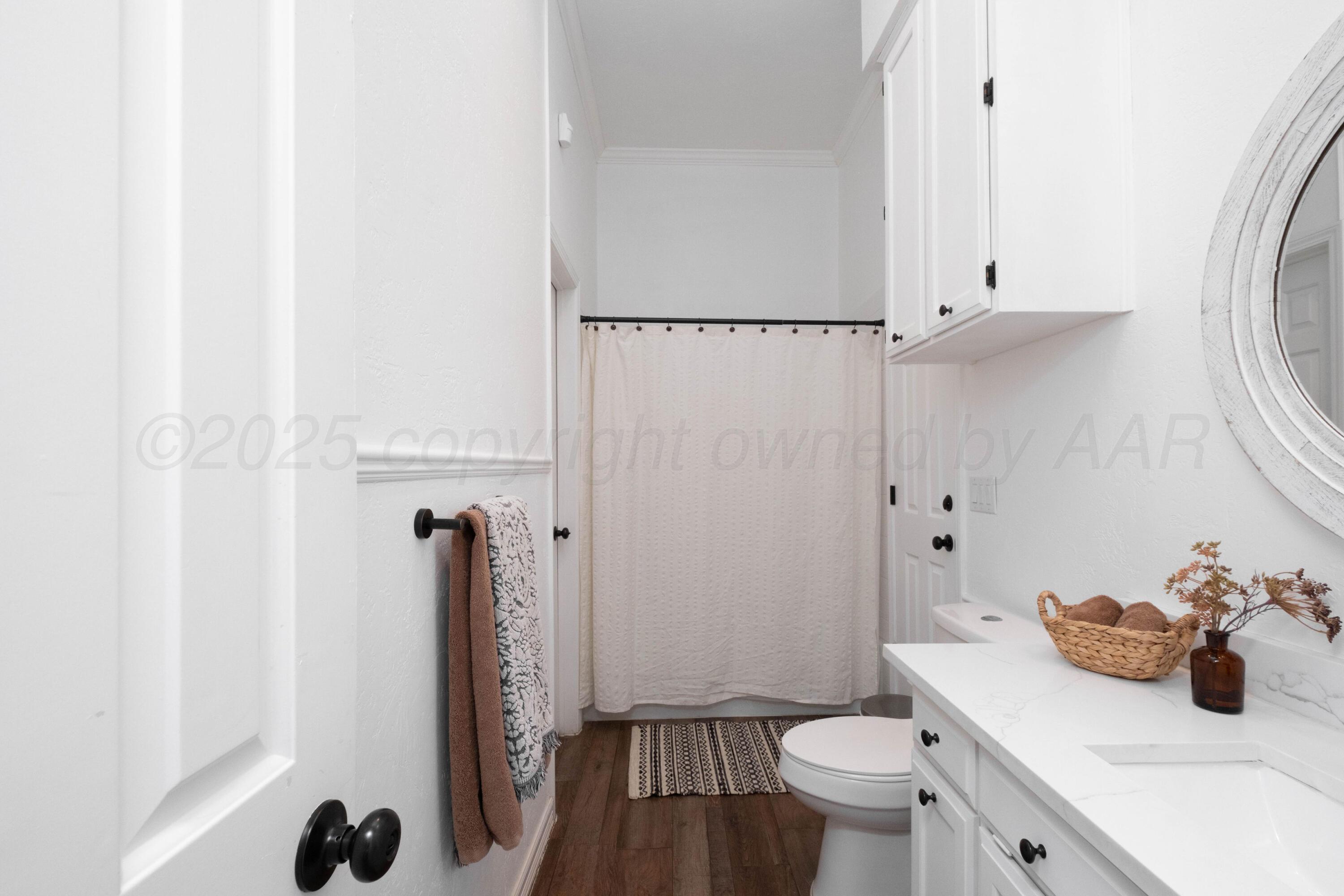3207 Parker Street Amarillo, TX 79109 - Photo 49 of 73 a bathroom with a sink toilet and shower