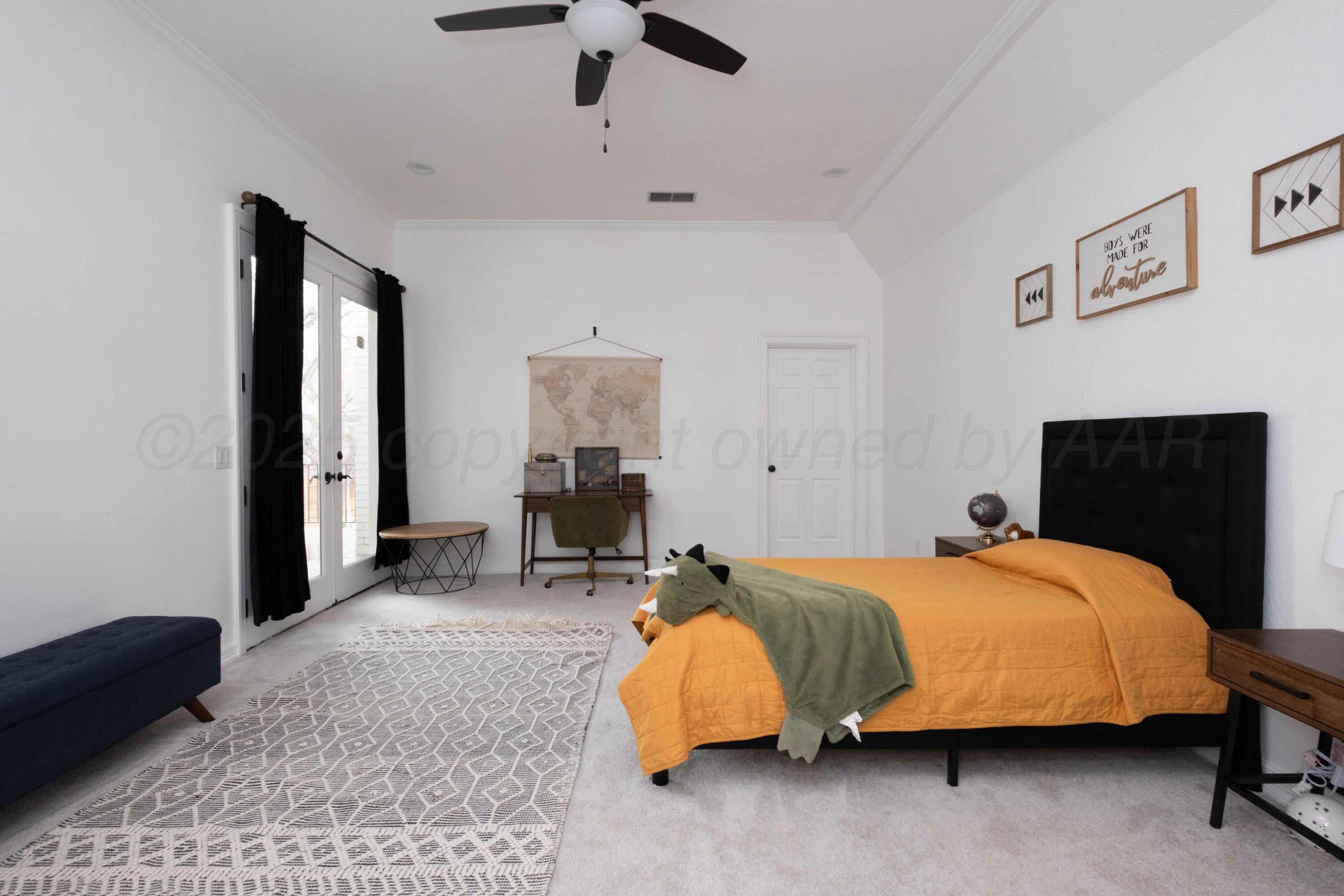 3207 Parker Street Amarillo, TX 79109 - Photo 59 of 73 a bedroom with a bed and lamp