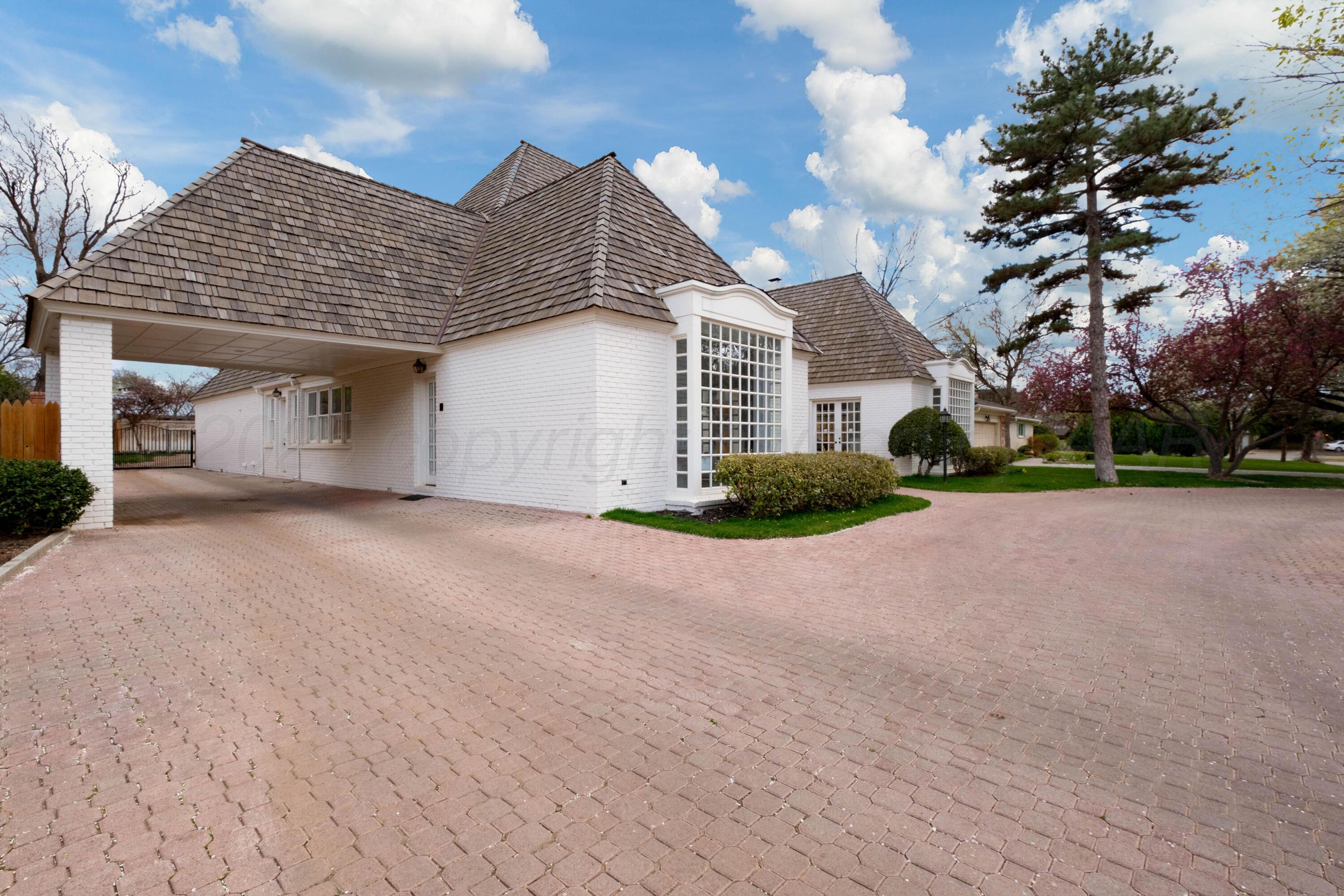 3207 Parker Street Amarillo, TX 79109 - Photo 7 of 73 a view of a house with a yard and garage