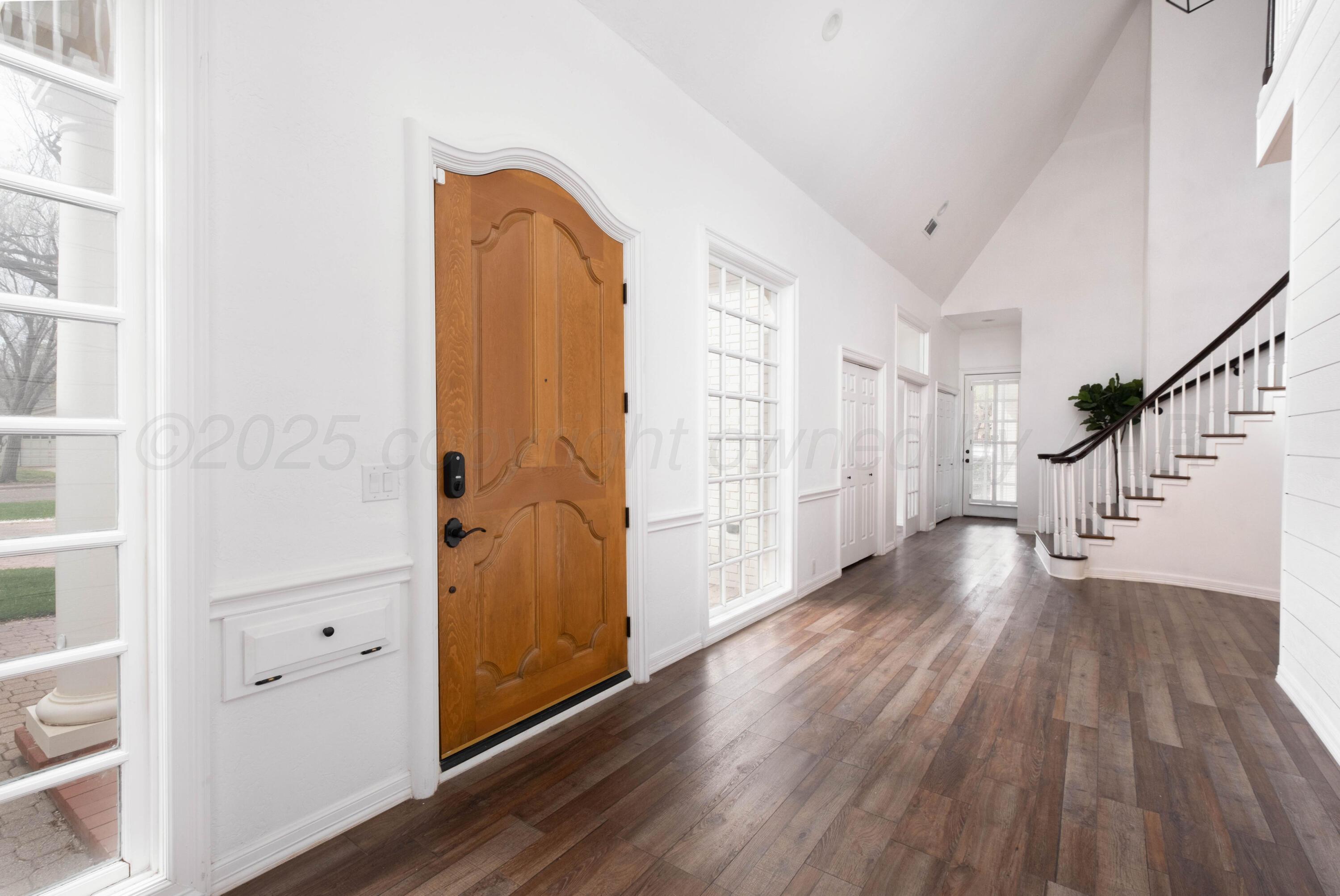 3207 Parker Street Amarillo, TX 79109 - Photo 9 of 73 a view of an entryway with wooden floor