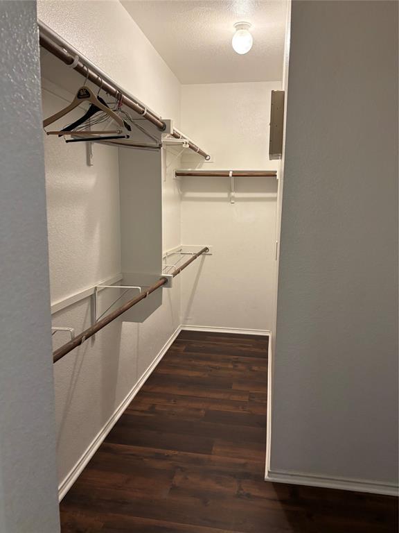 6546 Portside Ridge Lane Dallas, TX 75249 - Photo 24 of 35 Spacious closet featuring wood finished floors