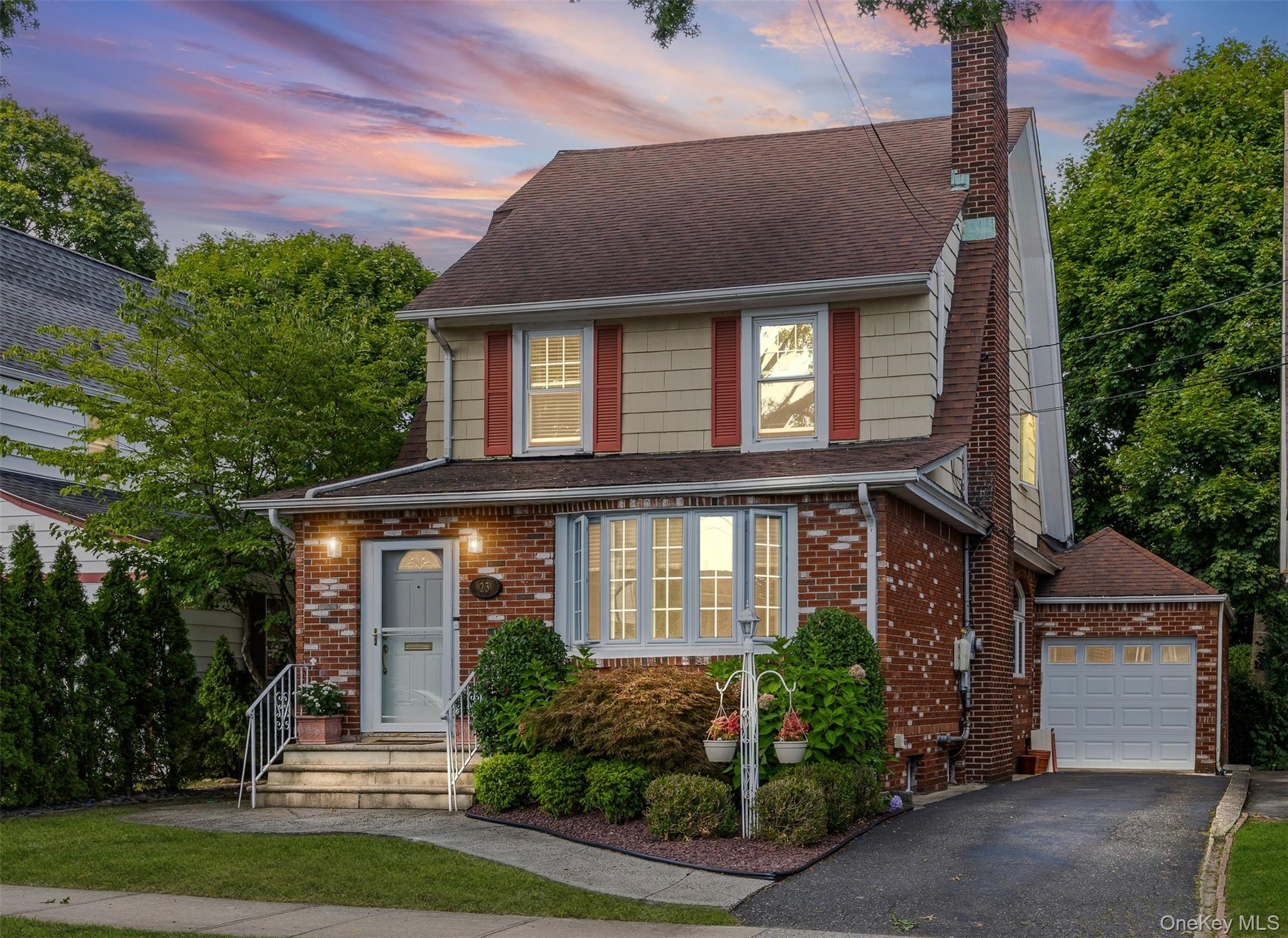 23 Nassau Road Great Neck, NY 11021 - Photo 1 of 1 a front view of a house with a yard