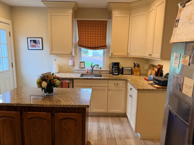 a kitchen with sink cabinets and window