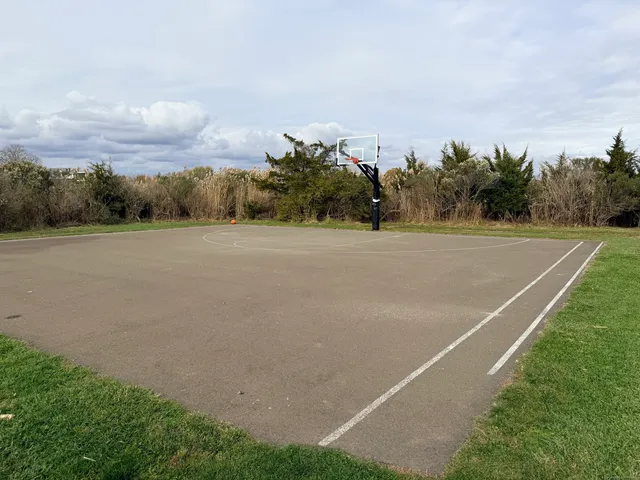 a view of an outdoor space and tennis court