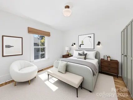 a view of a storage and utility room with wooden floor
