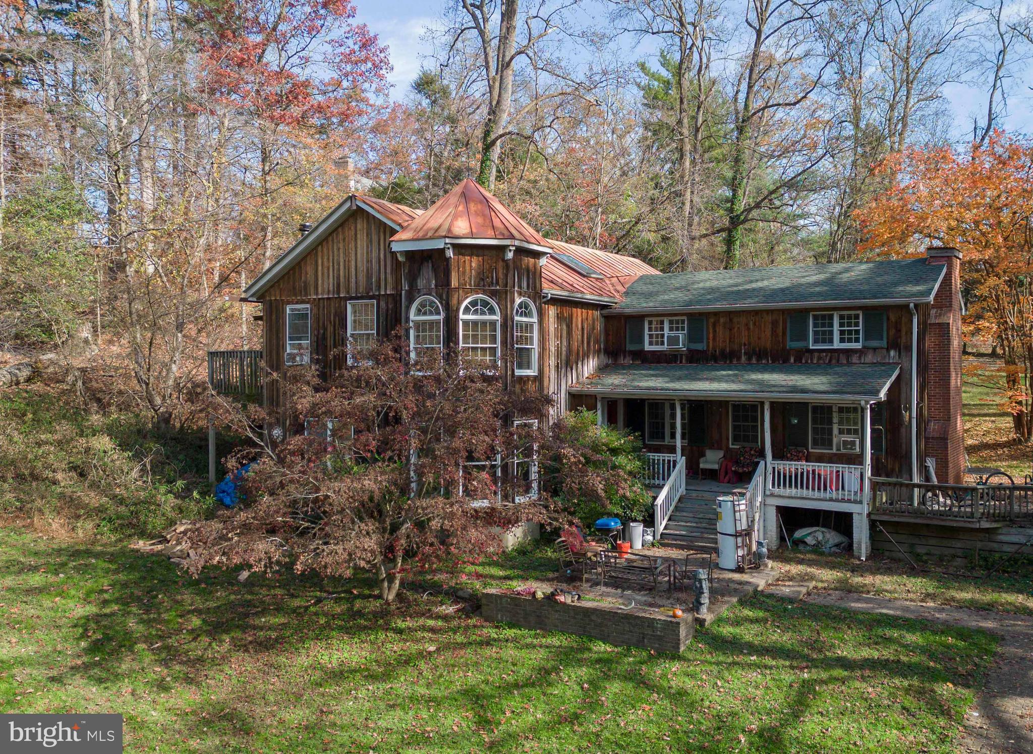 Hillside Lutherville-Timonium, MD 21093 - Photo 1 of 10 a front view of a house with a yard table and chairs