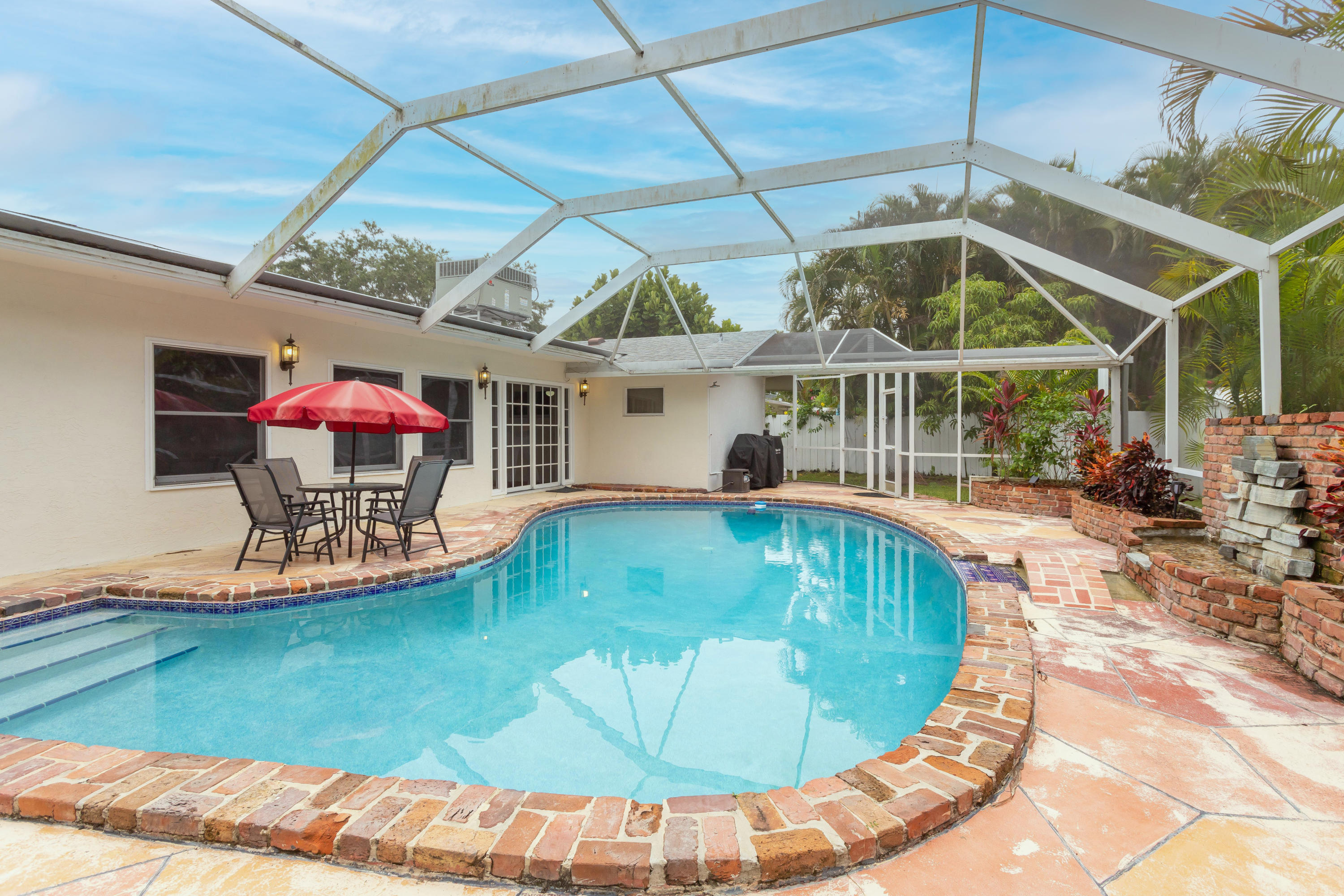a view of a swimming pool with a patio