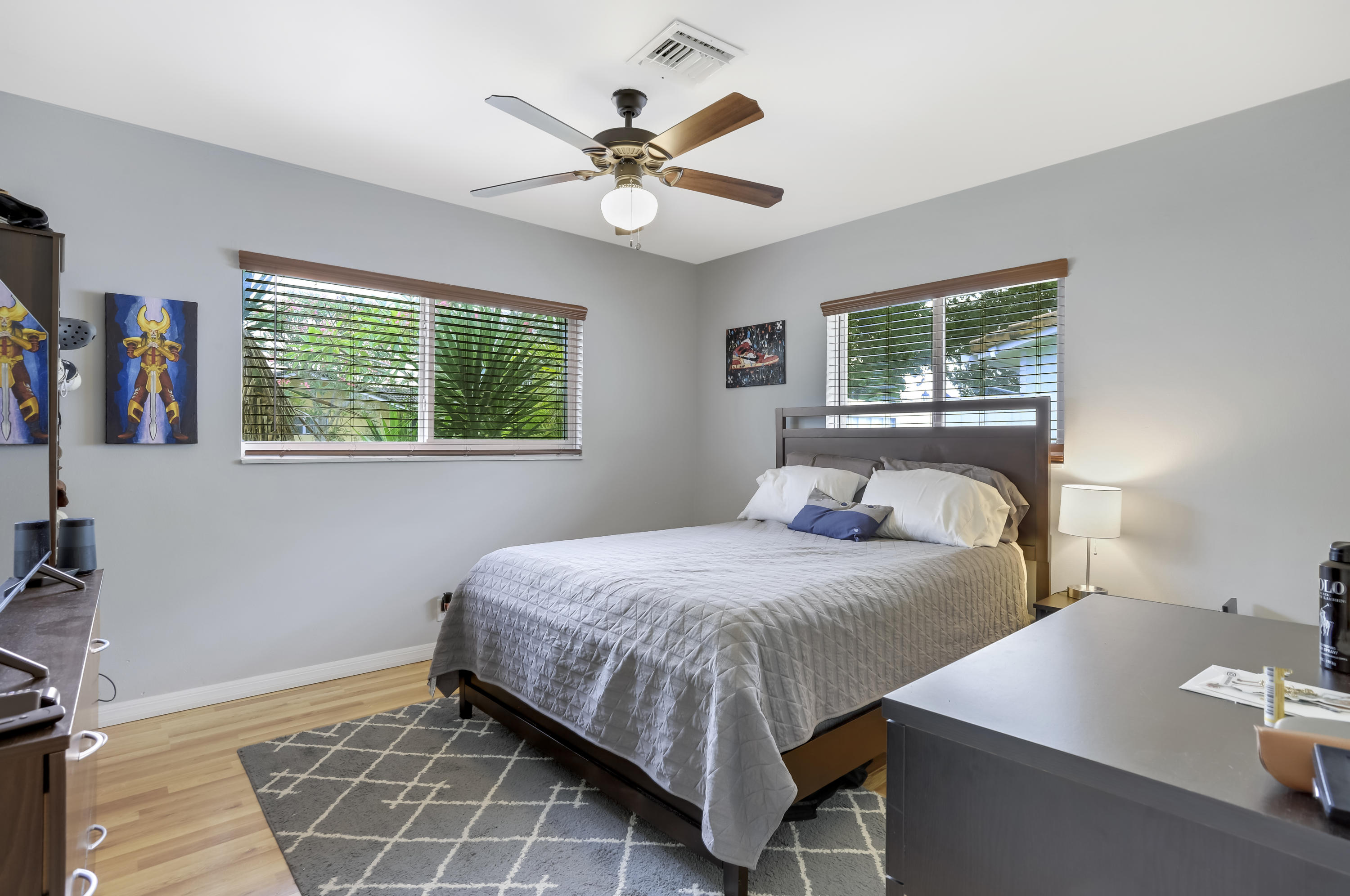 1346 Northwest 4th Street Boca Raton, FL 33486 - Photo 13 of 33 a bedroom with a bed and a chandelier