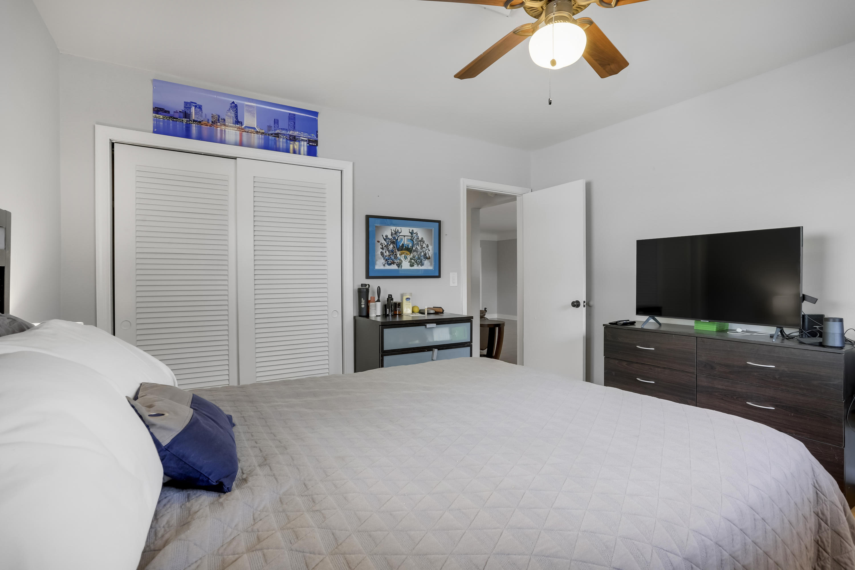 1346 Northwest 4th Street Boca Raton, FL 33486 - Photo 14 of 33 a bedroom with a bed and a flat screen tv
