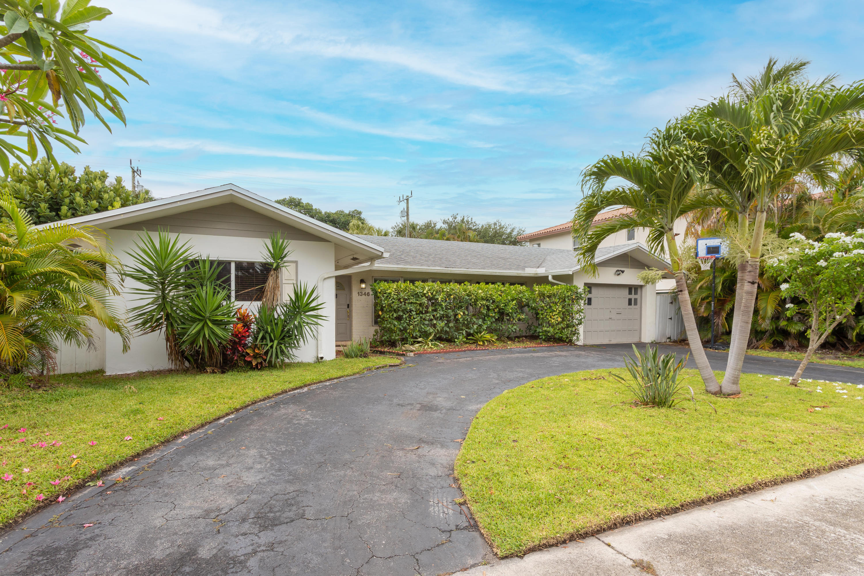 1346 Northwest 4th Street Boca Raton, FL 33486 - Photo 2 of 33 a view of a garden with a fountain