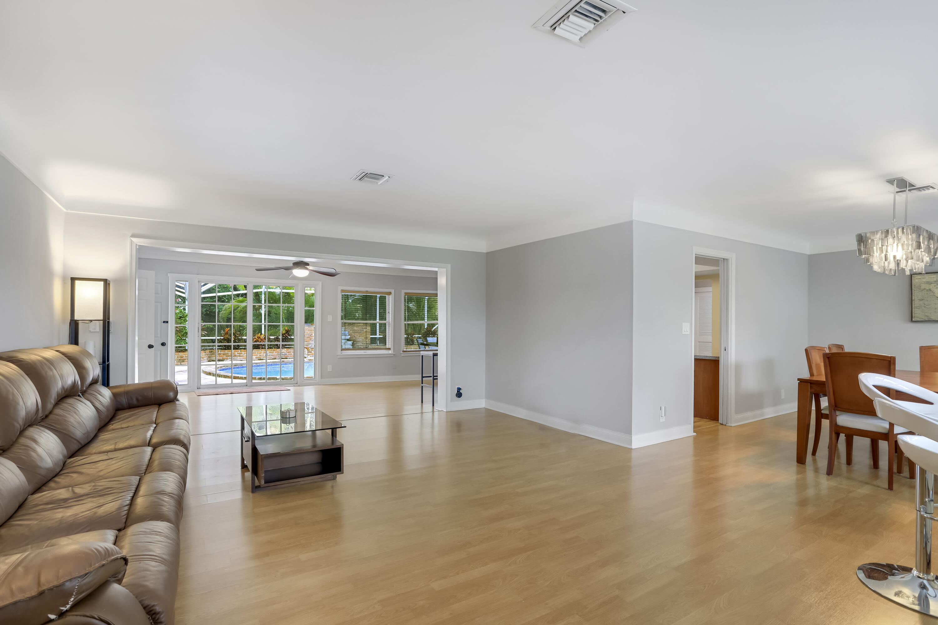1346 Northwest 4th Street Boca Raton, FL 33486 - Photo 3 of 33 a living room with furniture and a large window