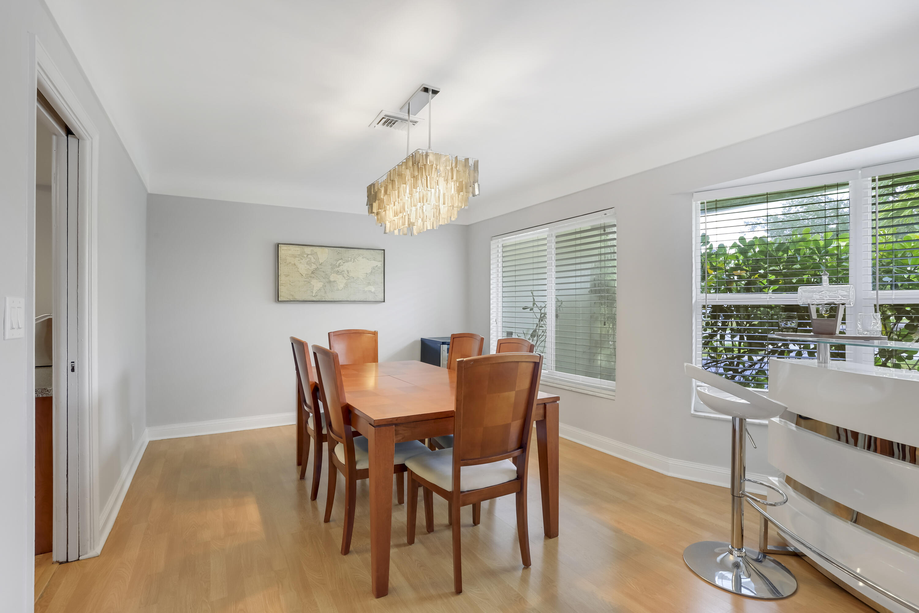 1346 Northwest 4th Street Boca Raton, FL 33486 - Photo 6 of 33 a view of a dining room with furniture window and wooden floor