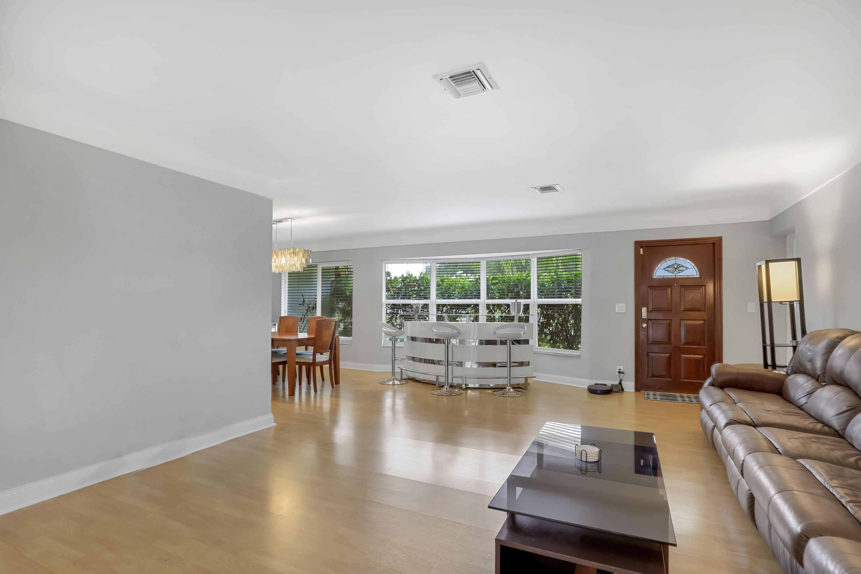 1346 Northwest 4th Street Boca Raton, FL 33486 - Photo 8 of 33 a living room with furniture and a large window