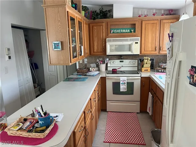 a living room with furniture a fireplace and a window