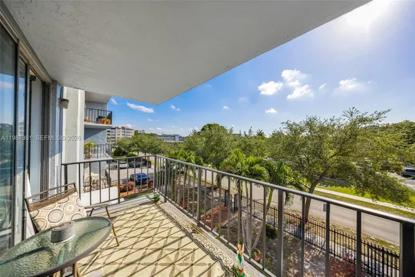 a view of walk in closet with clothes