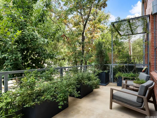 a backyard of a house with outdoor seating and green space