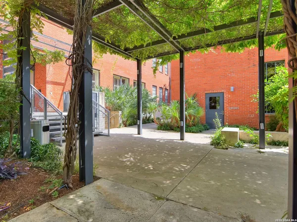 a view of tall trees in front of a building
