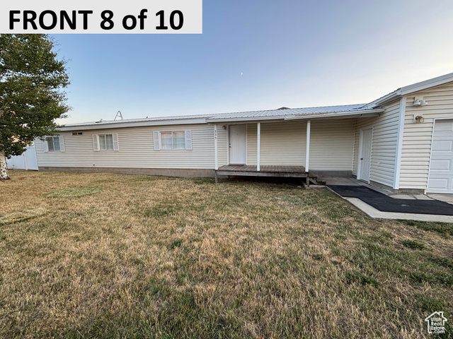 335 Memorial Park Road Henefer, UT 84033 - Photo 3 of 51 View of front of home with a front lawn, a metal roof, and a deck