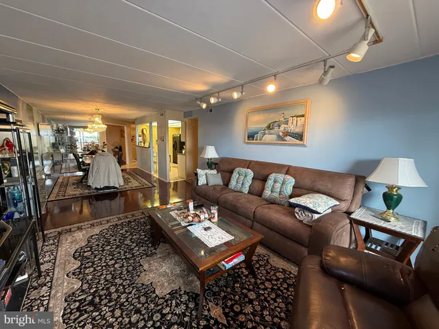 a living room with furniture and a rug