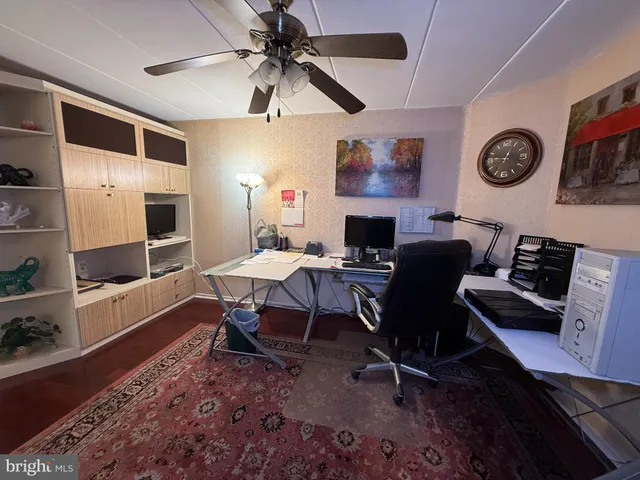 a view of a workspace with furniture