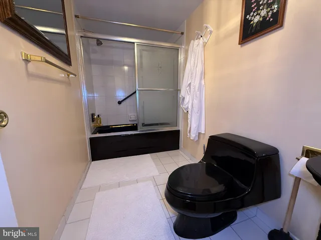 a kitchen with a sink and a mirror