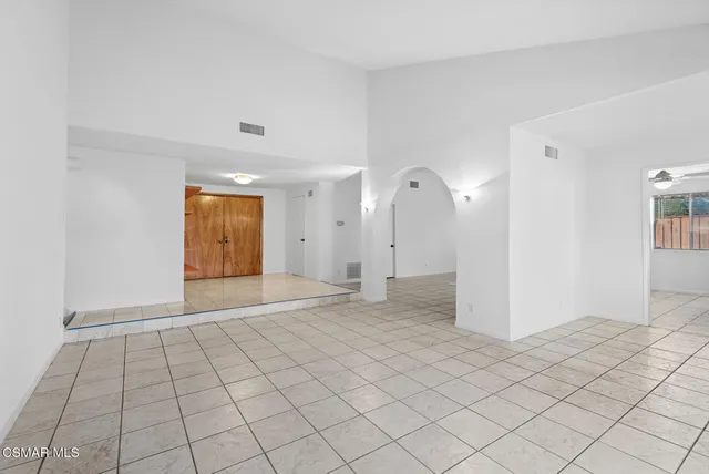 a view of an empty room and window