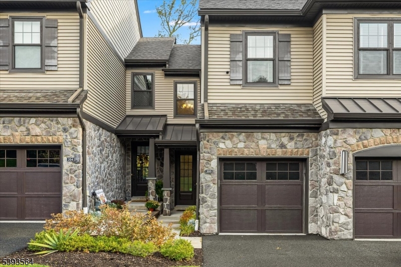 205 Mariners Pointe Hopatcong, NJ 07843 - Photo 1 of 31 a front view of a house with a yard and garage
