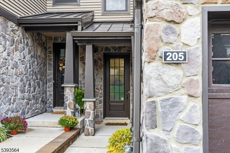 205 Mariners Pointe Hopatcong, NJ 07843 - Photo 2 of 31 a view of a brick building with a outdoor space