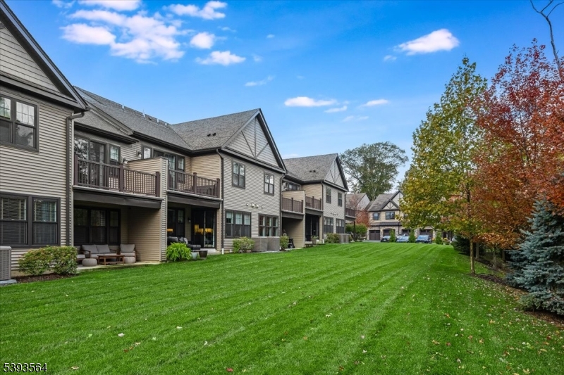 205 Mariners Pointe Hopatcong, NJ 07843 - Photo 23 of 31 a front view of a house with a yard porch and outdoor seating