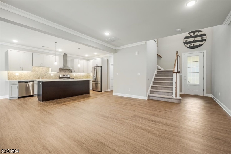 205 Mariners Pointe Hopatcong, NJ 07843 - Photo 3 of 31 a view of kitchen with wooden floor and windows