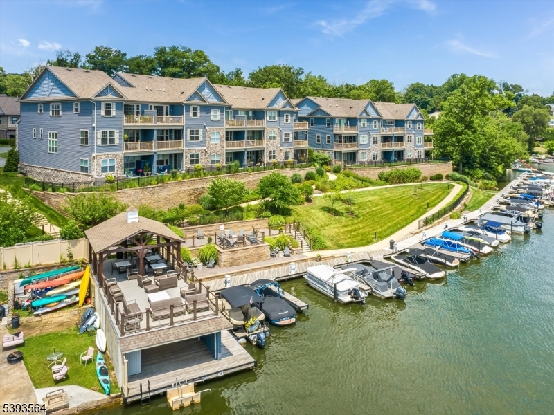 205 Mariners Pointe Hopatcong, NJ 07843 - Photo 31 of 31 an aerial view of a house with a garden and swimming pool