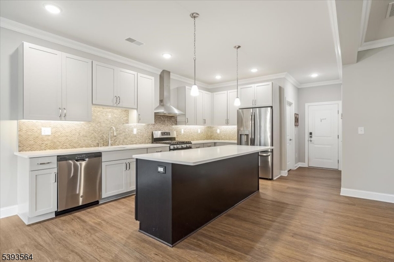 205 Mariners Pointe Hopatcong, NJ 07843 - Photo 4 of 31 a kitchen with stainless steel appliances granite countertop a sink stove and refrigerator