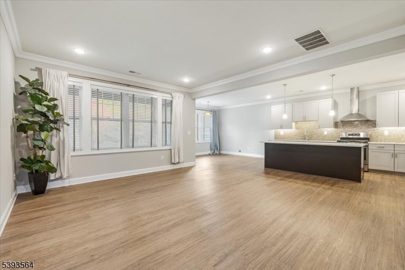 205 Mariners Pointe Hopatcong, NJ 07843 - Photo 5 of 31 a view of an empty room with a window and wooden floor