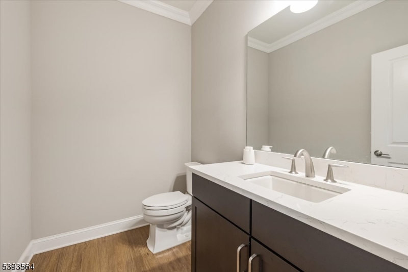 205 Mariners Pointe Hopatcong, NJ 07843 - Photo 10 of 31 a bathroom with a sink a toilet and a mirror