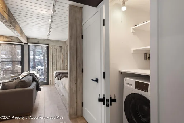 a view of a building with yard and sitting area