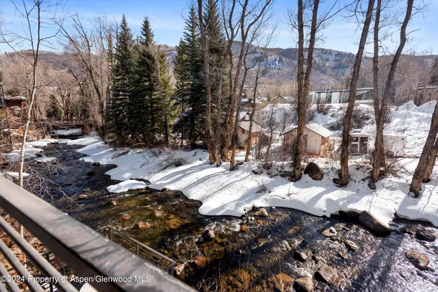 a couple of cars parked in a yard