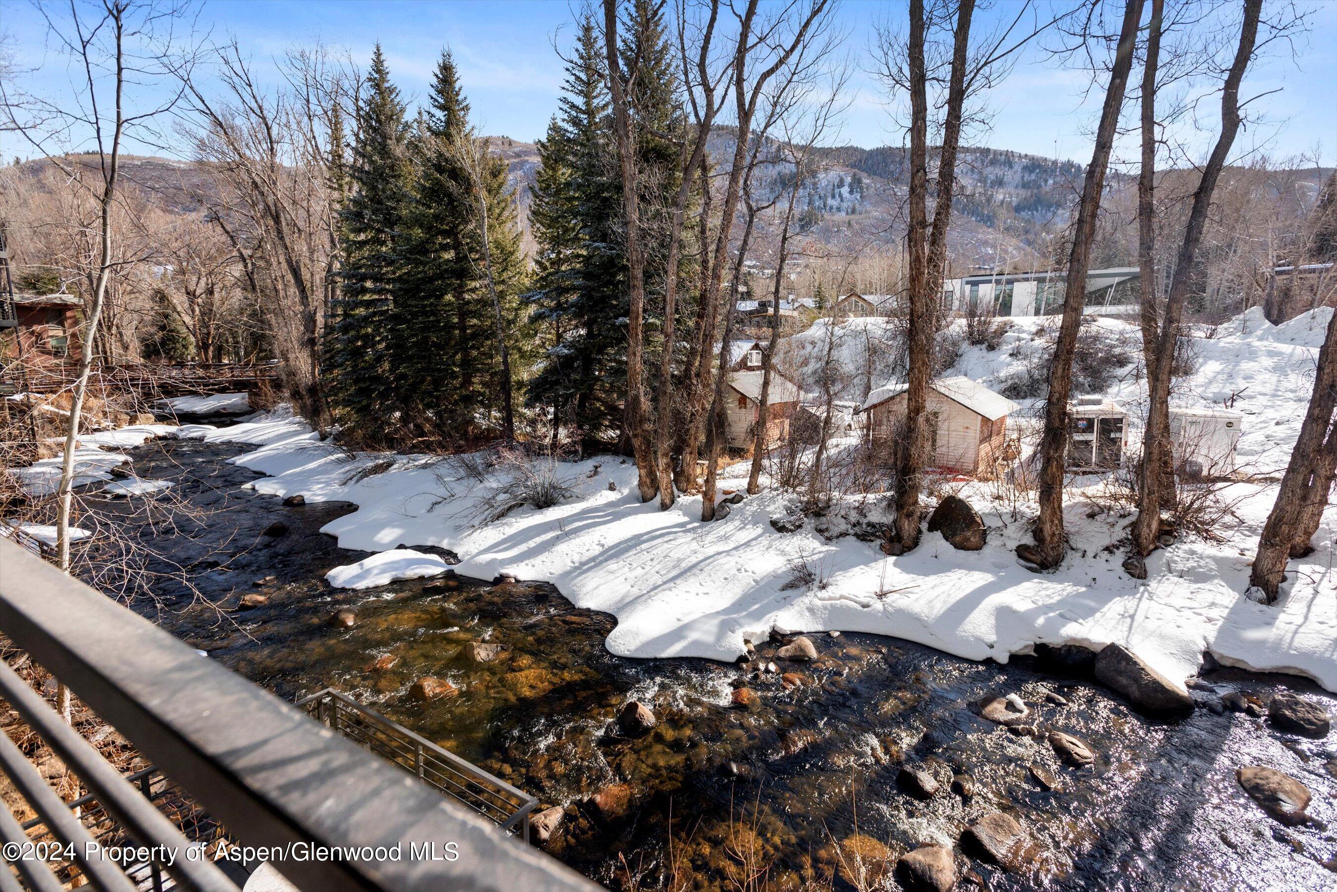 1039 East Cooper Avenue, Unit 19B Aspen, CO 81611 - Photo 6 of 13 a couple of cars parked in a yard