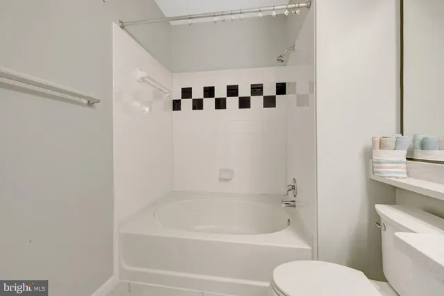 a bathroom with a sink a mirror and a shower