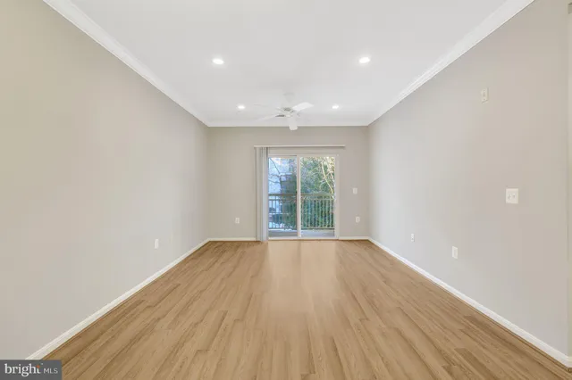 a view of a glass door with a glass door and deck