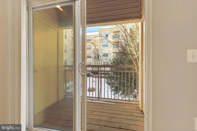 a view of a balcony with wooden floor