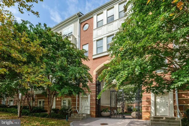 a living room with furniture a chandelier and a flat screen tv