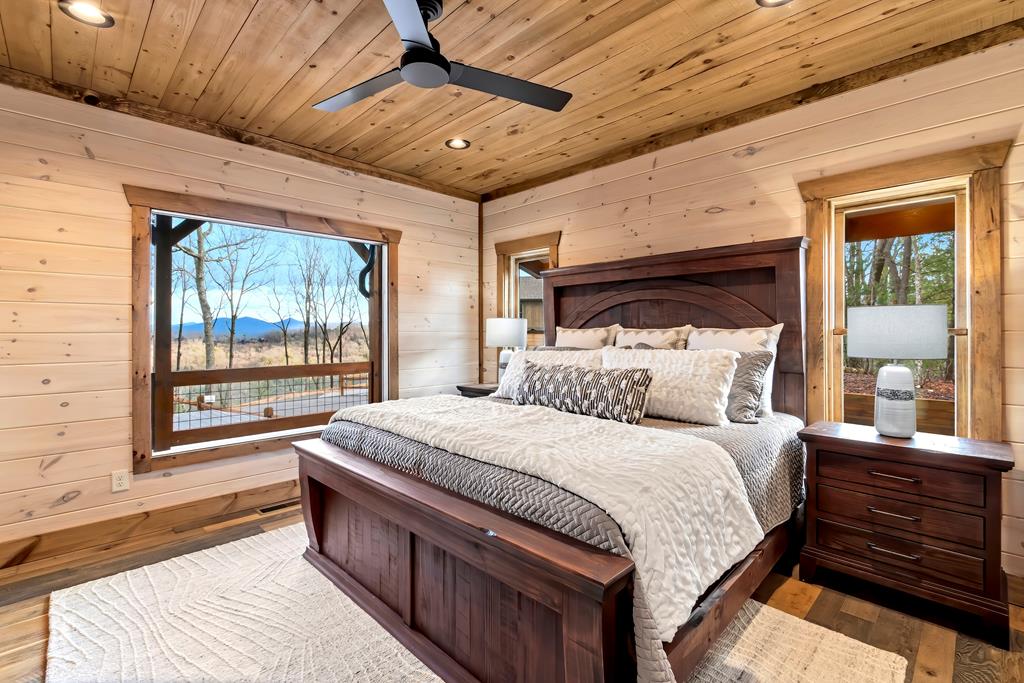 470 Skylight Drive Blue Ridge, GA 30513 - Photo 24 of 83 a bedroom with a large bed and a large window