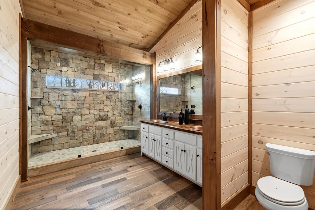 470 Skylight Drive Blue Ridge, GA 30513 - Photo 26 of 83 a bathroom with a double vanity sink toilet and shower
