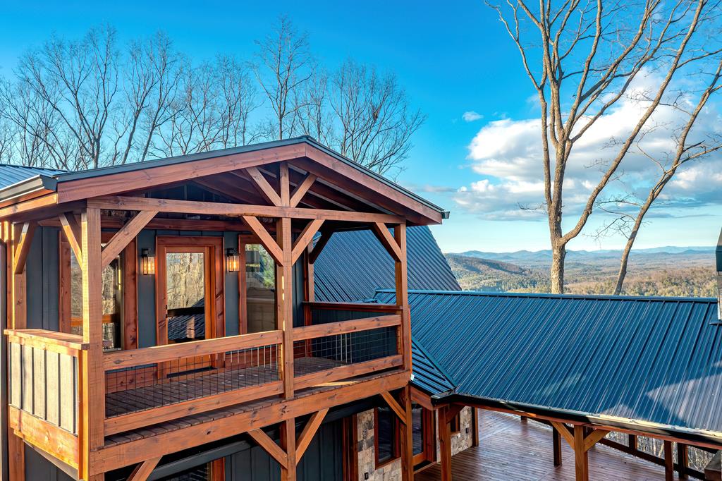 470 Skylight Drive Blue Ridge, GA 30513 - Photo 37 of 83 a view of a wooden chairs and table in the balcony