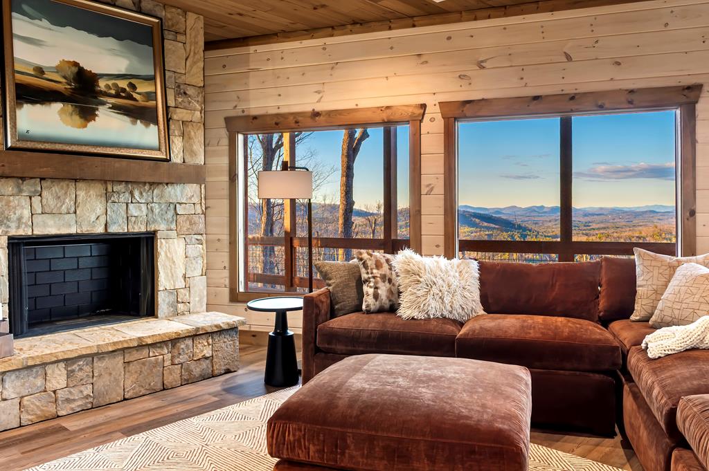 470 Skylight Drive Blue Ridge, GA 30513 - Photo 55 of 83 a living room with furniture and a fireplace