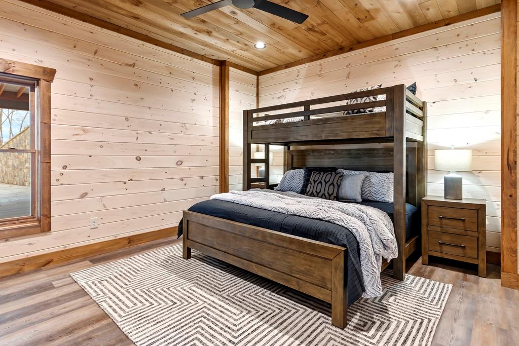 470 Skylight Drive Blue Ridge, GA 30513 - Photo 70 of 83 a bedroom with a bed and wooden floor