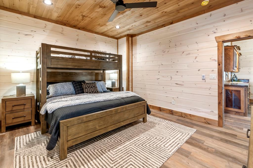 470 Skylight Drive Blue Ridge, GA 30513 - Photo 72 of 83 a bedroom with a bed and wooden floor