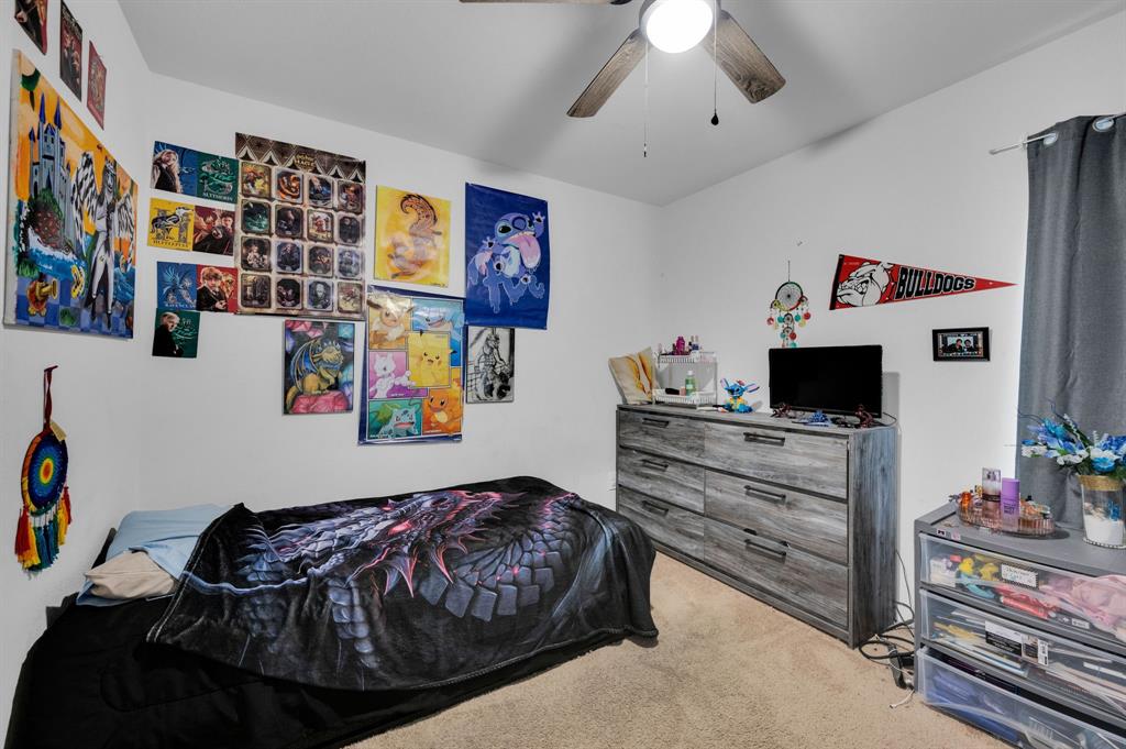 2609 Centurion Road Glenn Heights, TX 75154 - Photo 19 of 29 Bedroom with light colored carpet and a ceiling fan
