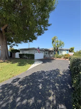 a view of a house with a yard balcony and sitting area