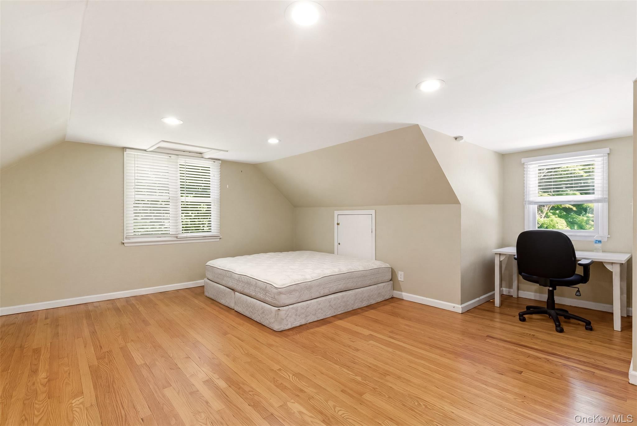 106 Vineyard Road Huntington, NY 11743 - Photo 21 of 25 a bedroom with a bed and a window